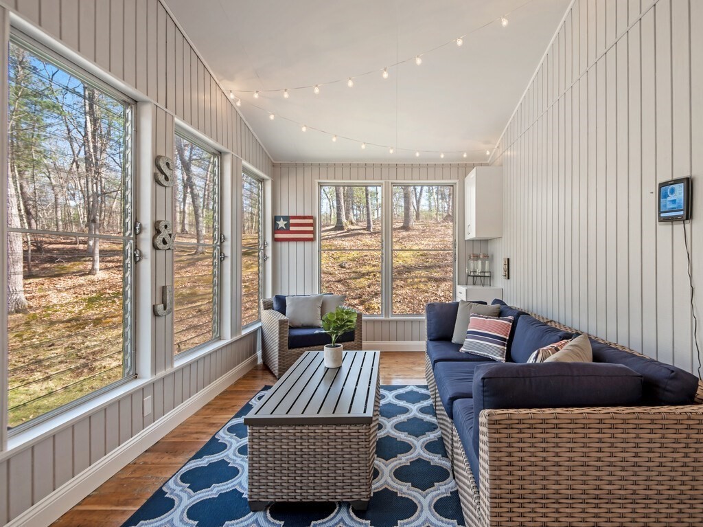 552 Lowell Road Groton, MA 01450 - Photo 16 of 42 a living room with furniture and a large window
