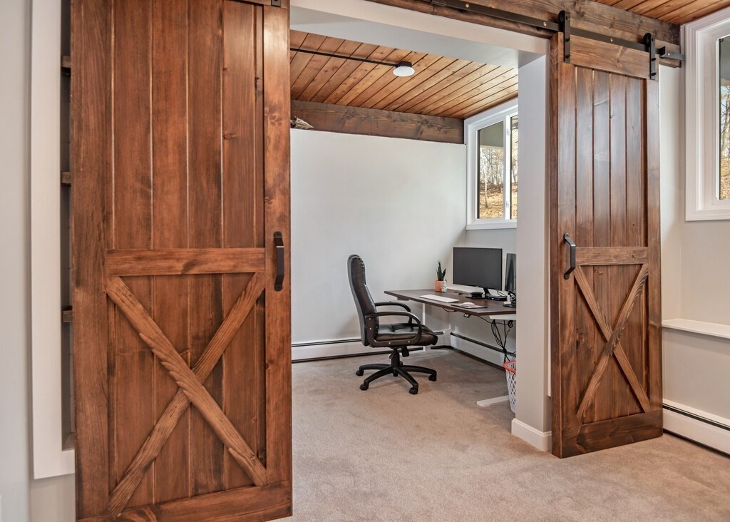 552 Lowell Road Groton, MA 01450 - Photo 27 of 42 a view of a workspace with furniture and a window
