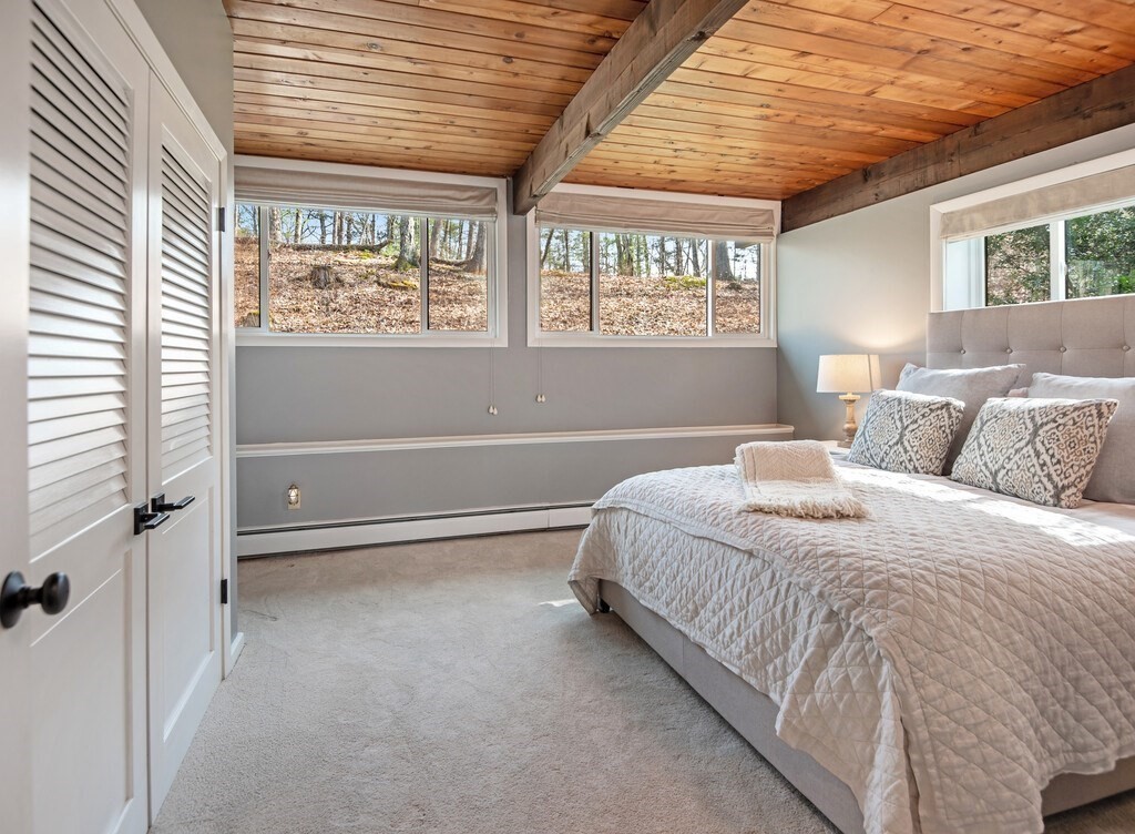 552 Lowell Road Groton, MA 01450 - Photo 29 of 42 a bedroom with a bed and a window