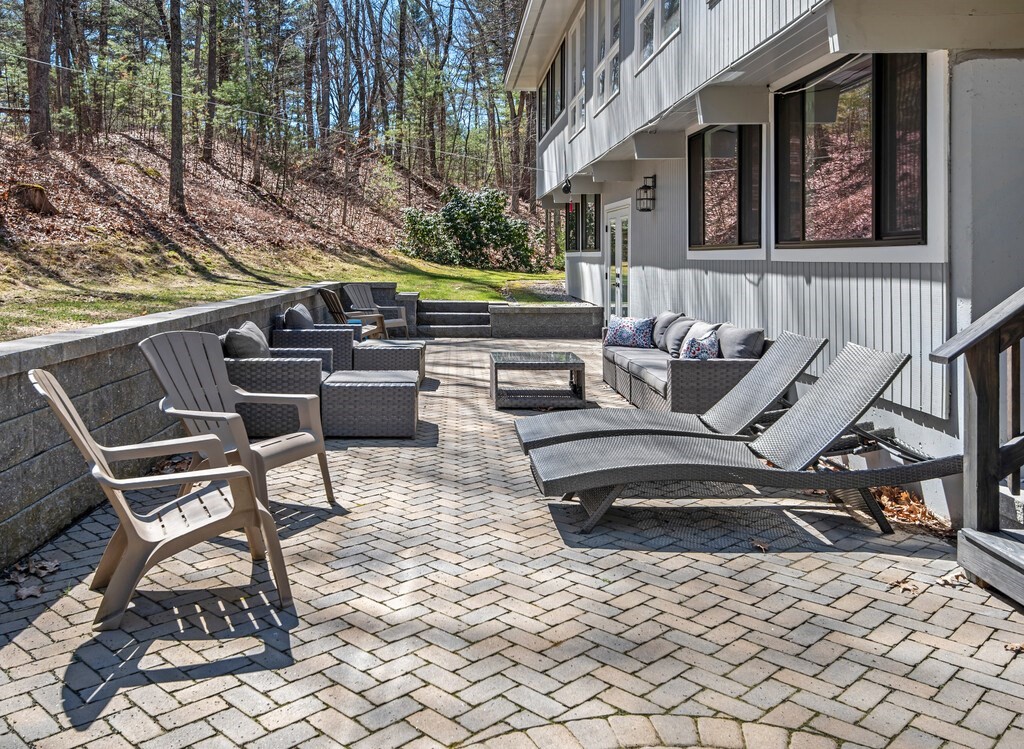 552 Lowell Road Groton, MA 01450 - Photo 4 of 42 a building outdoor space with patio furniture
