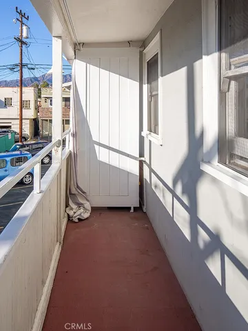 a view of a kitchen with a sink and cabinets