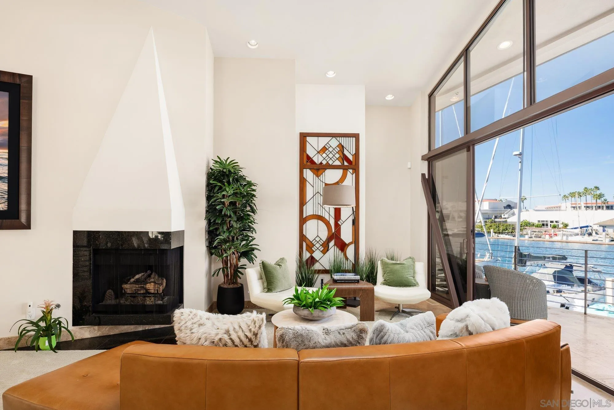 25 The Point Coronado, CA 92118 - Photo 11 of 74 a living room with furniture fireplace and potted plants