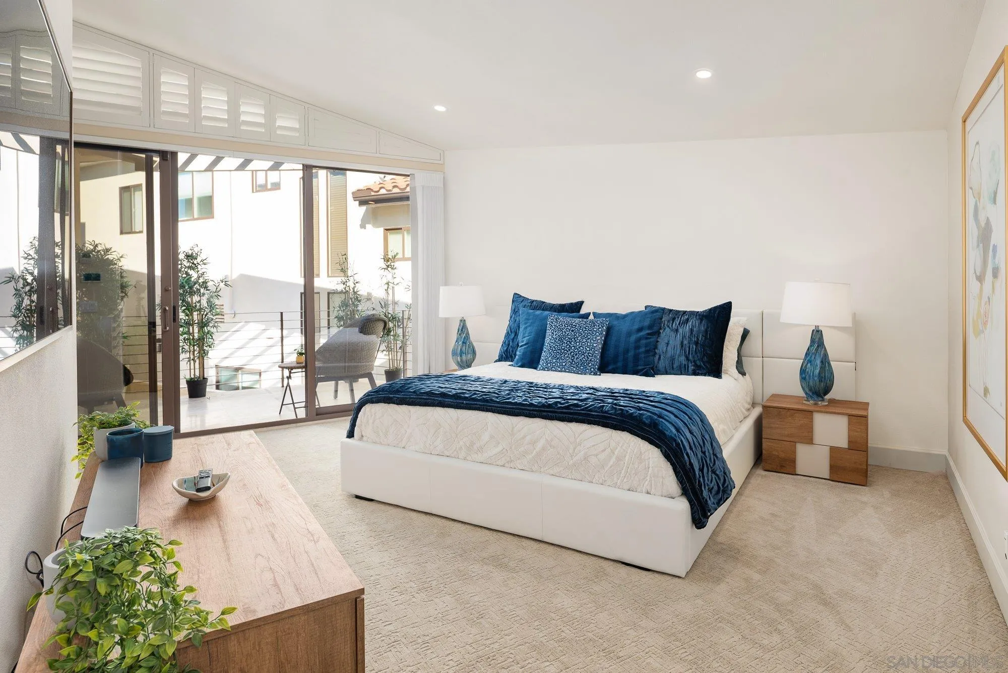 25 The Point Coronado, CA 92118 - Photo 30 of 74 a bedroom with a large bed and a large window