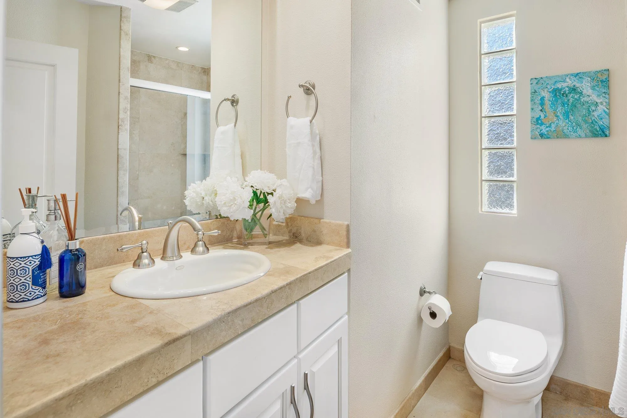 25 The Point Coronado, CA 92118 - Photo 37 of 74 a bathroom with a granite countertop sink toilet and shower