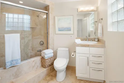 an aerial view of a house with a ocean view