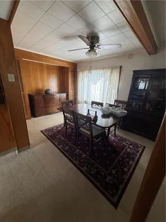 a living room with furniture a window and a chandelier