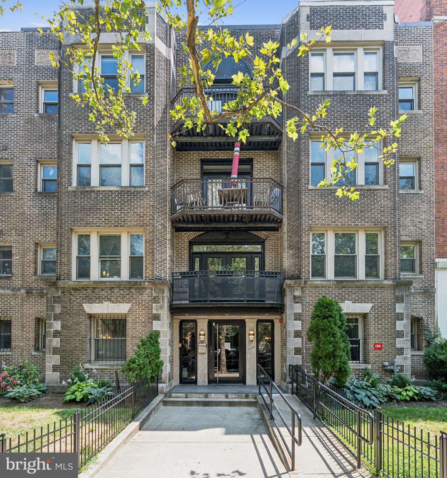 1440 Columbia Road Northwest, Unit 204 Washington, DC 20009 - Photo 1 of 23 a front view of a building with a garden