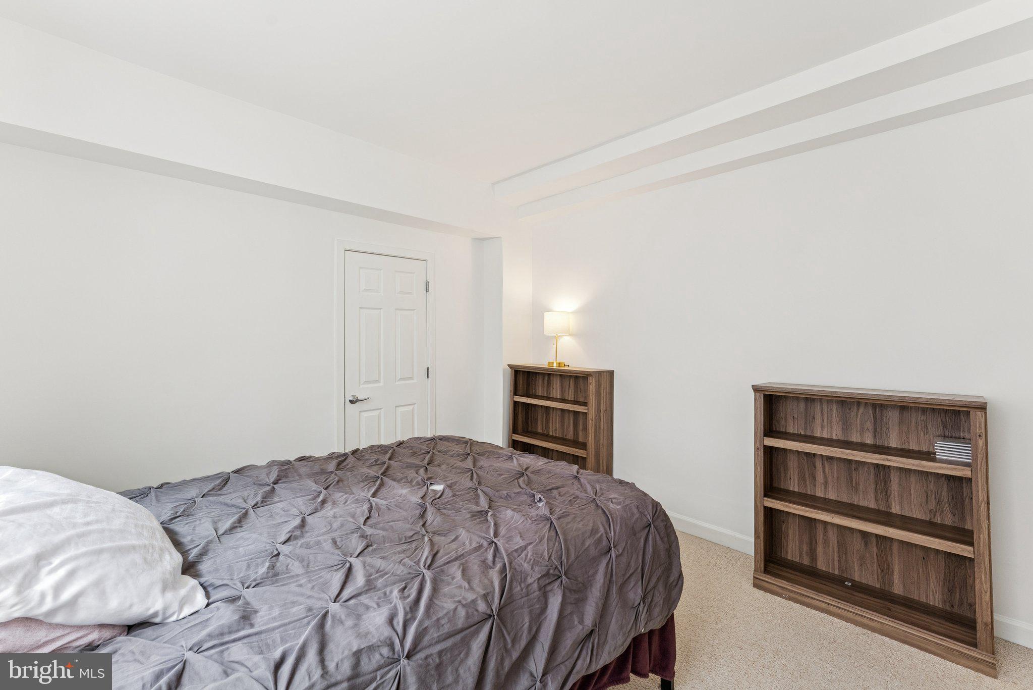 1440 Columbia Road Northwest, Unit 204 Washington, DC 20009 - Photo 11 of 23 a bedroom with a bed and a closet