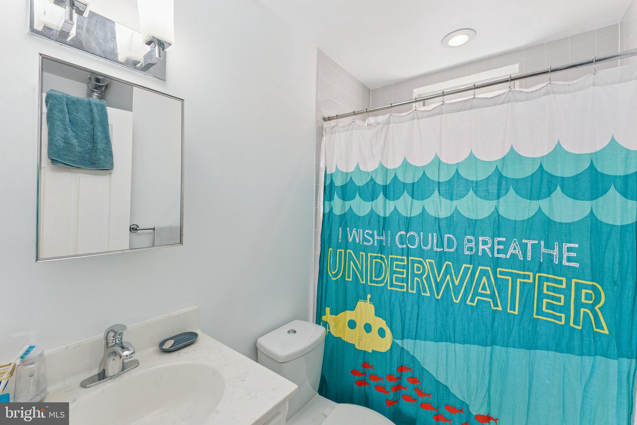 1440 Columbia Road Northwest, Unit 204 Washington, DC 20009 - Photo 18 of 23 a bathroom with a sink and a mirror
