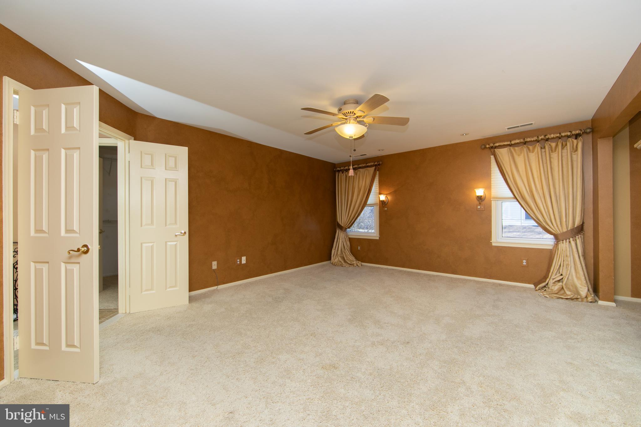 23 Fulton Drive Mount Laurel, NJ 08054 - Photo 27 of 46 an empty room with a window and a ceiling fan