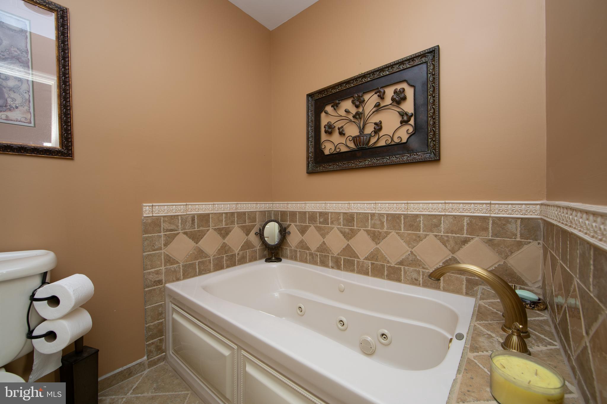 23 Fulton Drive Mount Laurel, NJ 08054 - Photo 33 of 46 a bathroom with a white tub and toilet