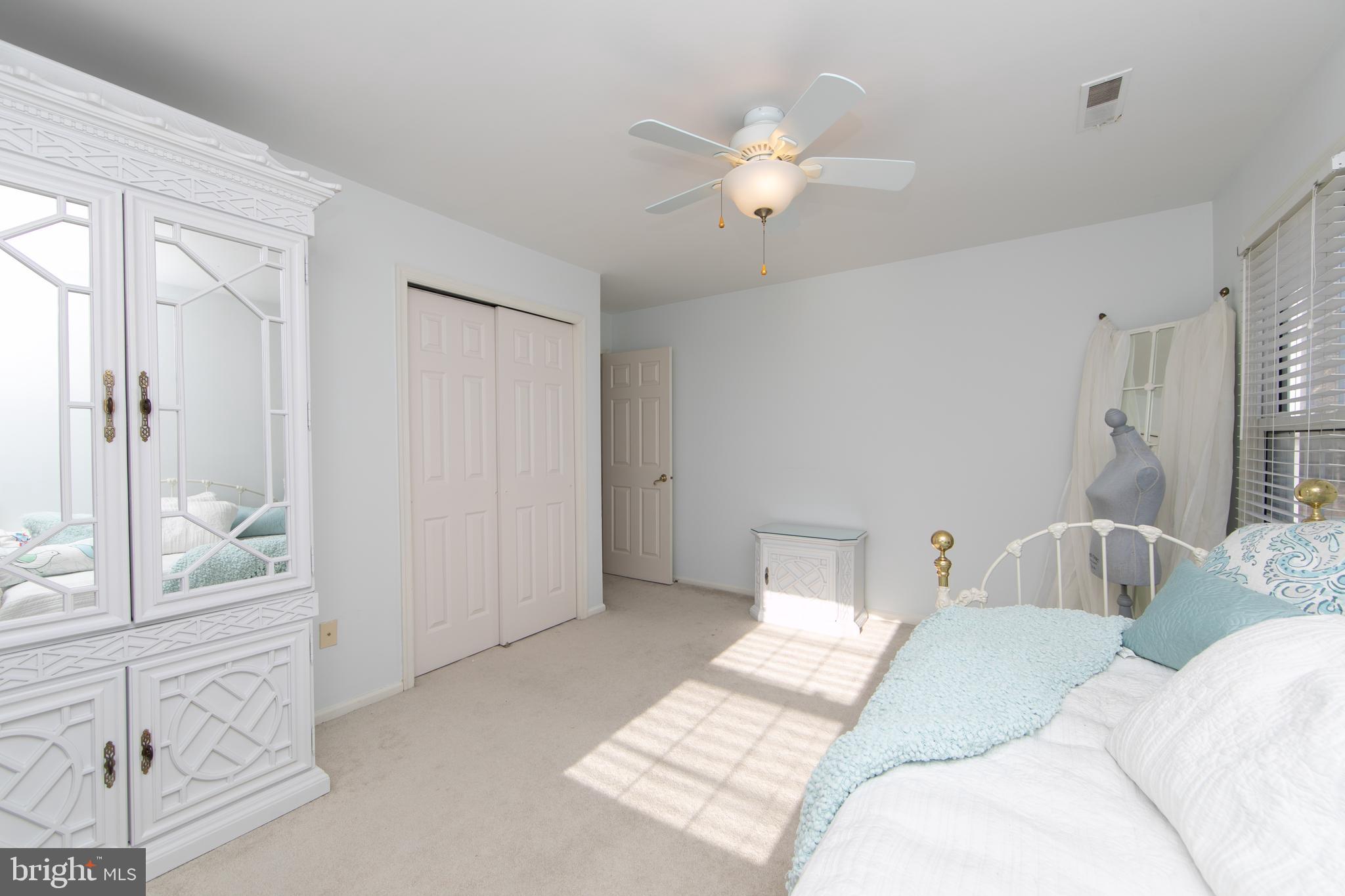 23 Fulton Drive Mount Laurel, NJ 08054 - Photo 37 of 46 a bedroom with a bed and a chandelier