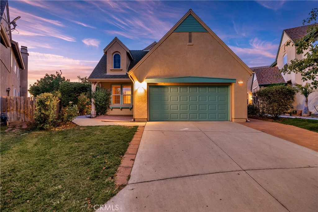 493 Poets Square Fallbrook, CA 92028 - Photo 1 of 1 a front view of a house with a yard and garage