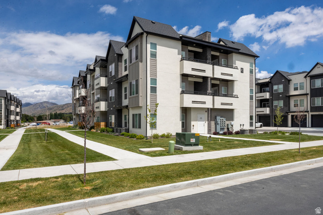 3115 South 200 West, Unit C201 Nibley, UT 84321 - Photo 19 of 23 Contemporary multi-story building featuring light stucco and dark siding accents