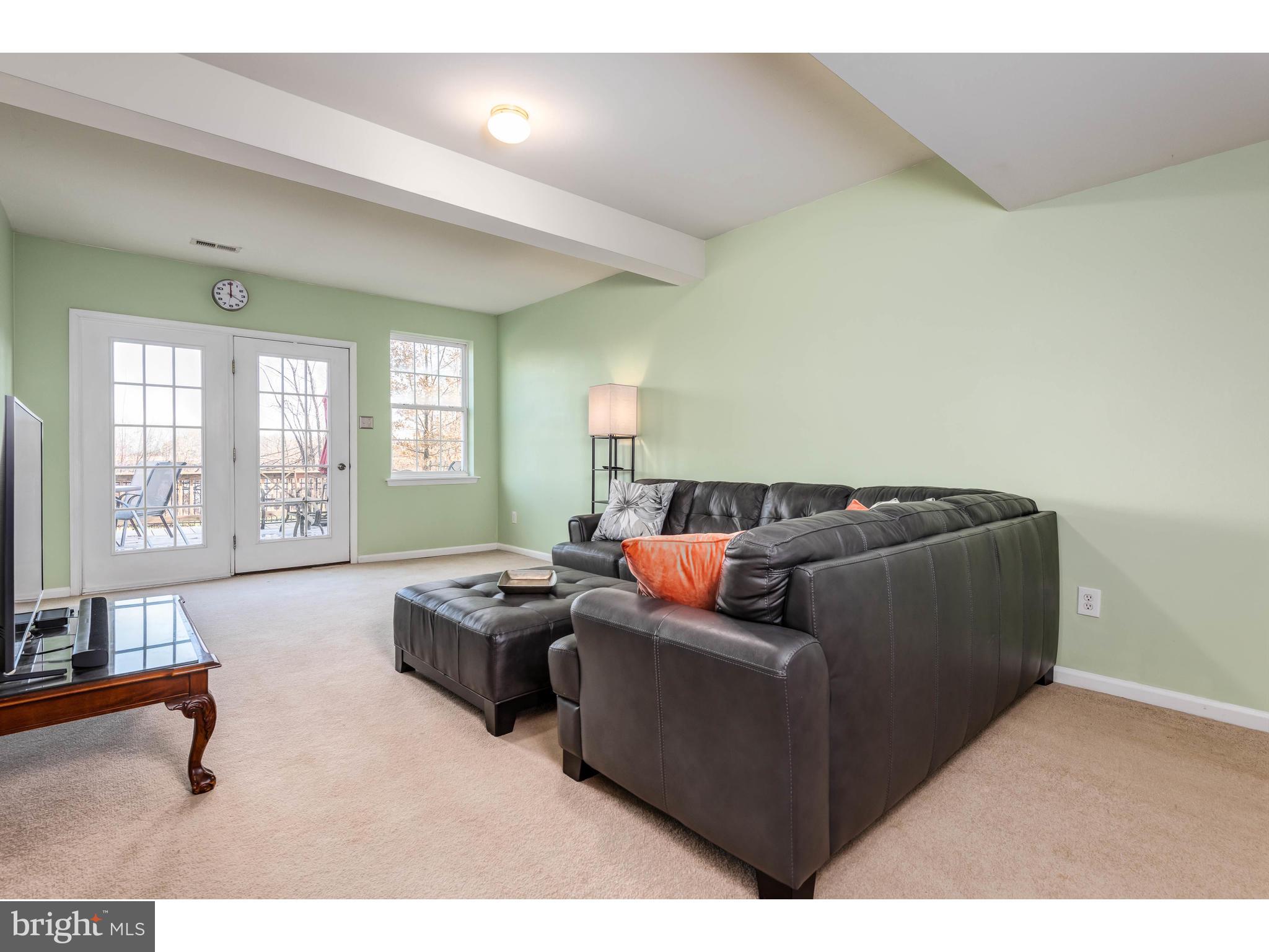 922 Nottingham Road Pottstown, PA 19465 - Photo 38 of 55 Full-size living room with private entrance & deck