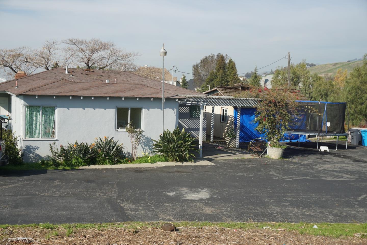 2310 Mt Pleasant Road San Jose, CA 95148 - Photo 1 of 12 a view of a house with a garden and pathway