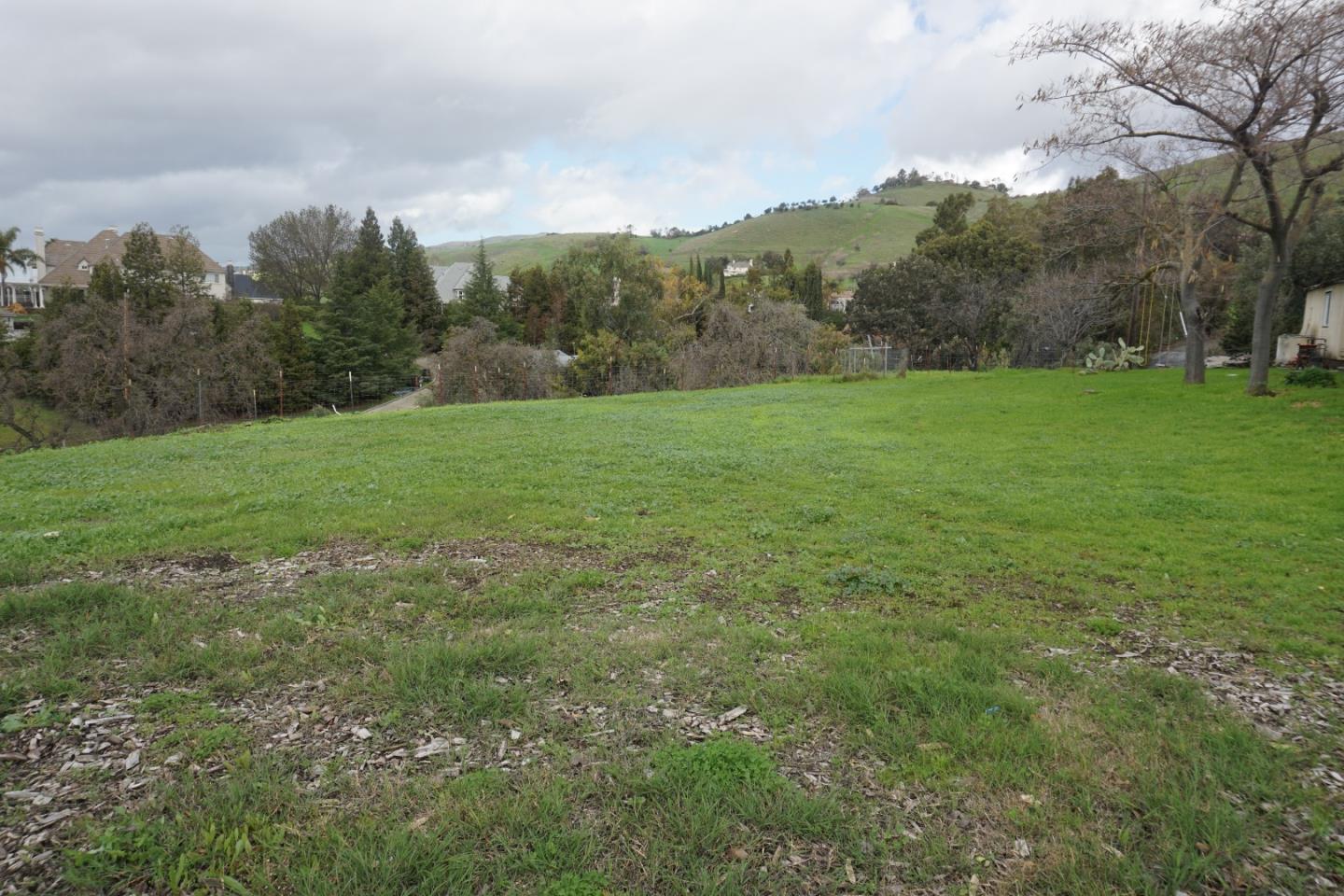 2310 Mt Pleasant Road San Jose, CA 95148 - Photo 12 of 12 a view of a field with an trees in the background