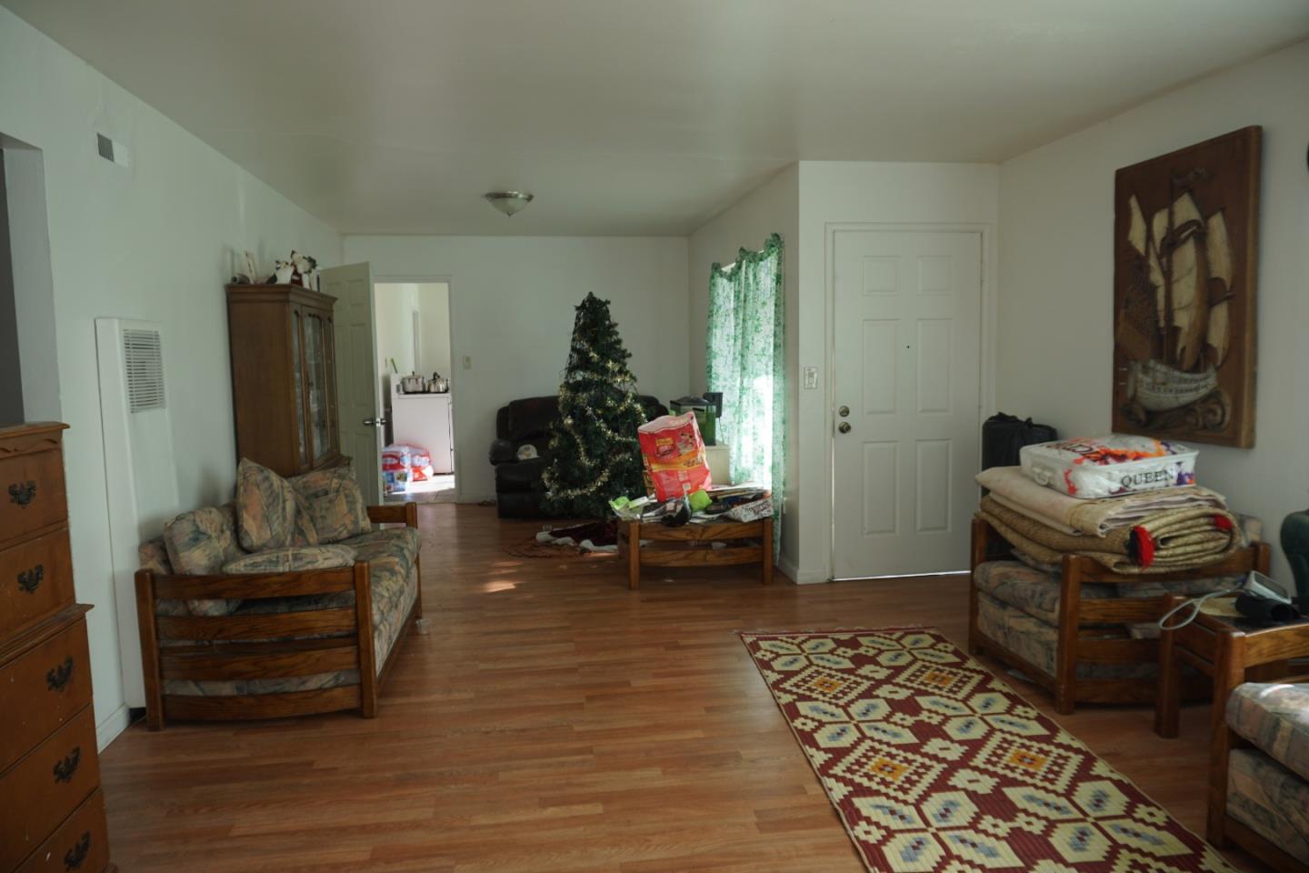 2310 Mt Pleasant Road San Jose, CA 95148 - Photo 5 of 12 a bedroom with furniture and a wooden floor