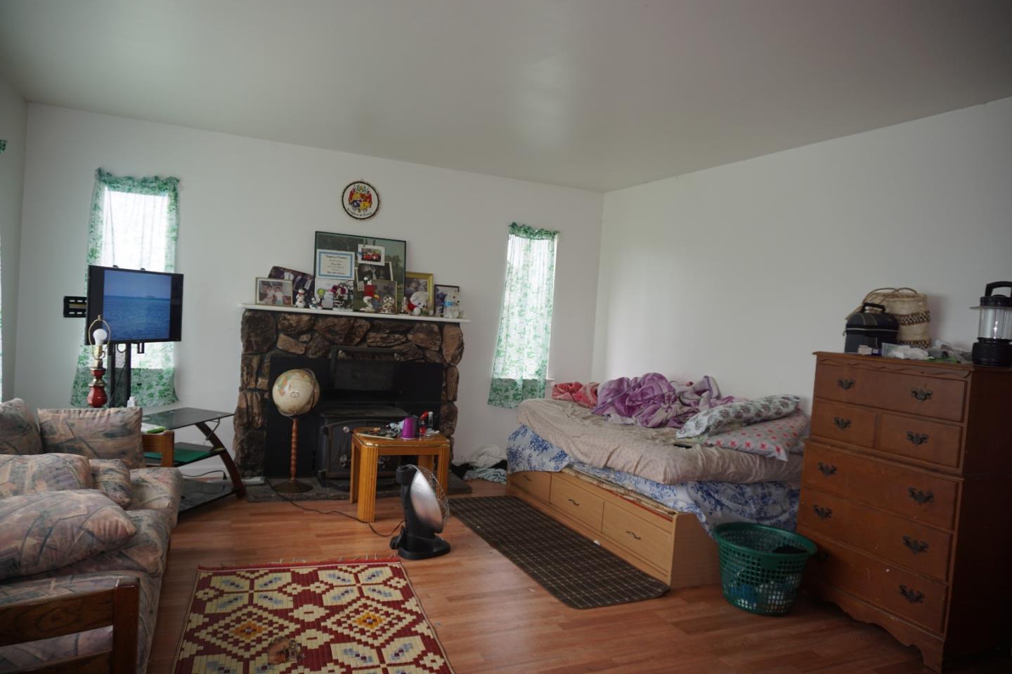 2310 Mt Pleasant Road San Jose, CA 95148 - Photo 7 of 12 a living room with furniture and a fireplace