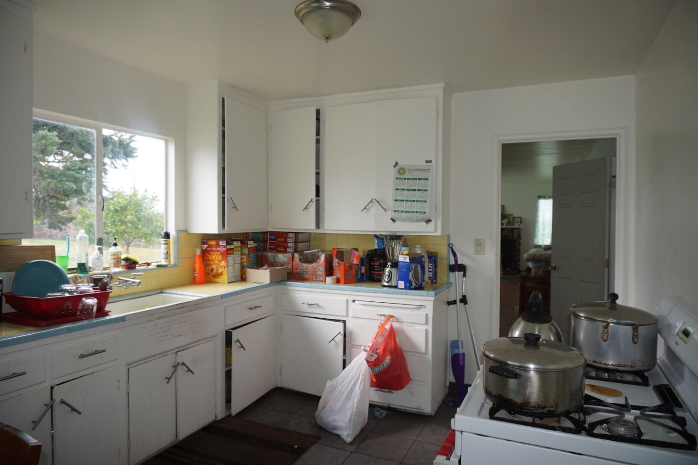 2310 Mt Pleasant Road San Jose, CA 95148 - Photo 9 of 12 a kitchen with a sink and cabinets
