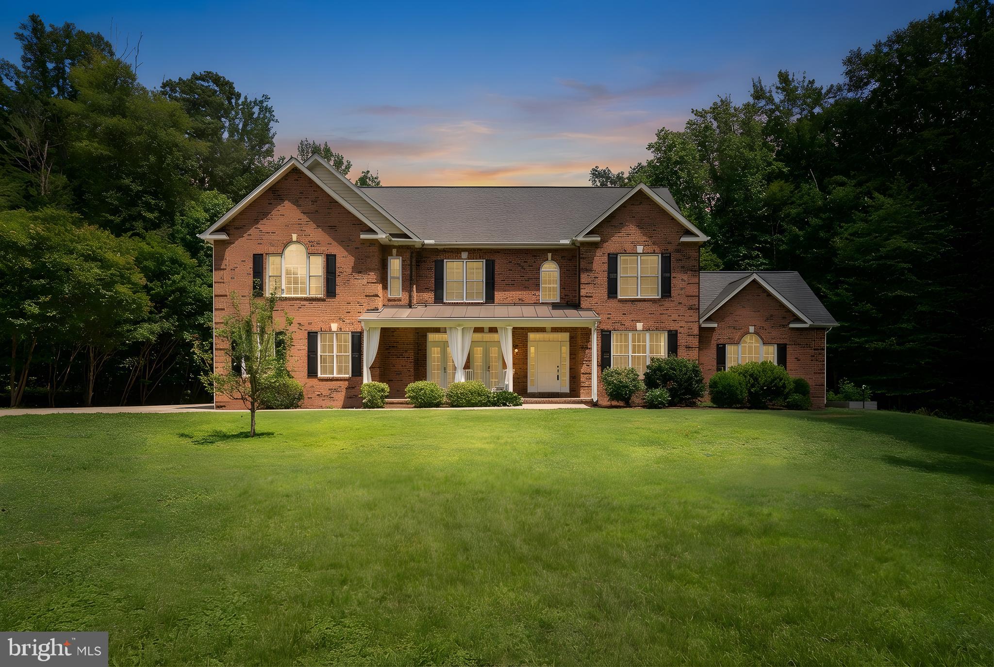 182 Wood Landing Road Fredericksburg, VA 22405 - Photo 1 of 102 a front view of a house with a yard and trees