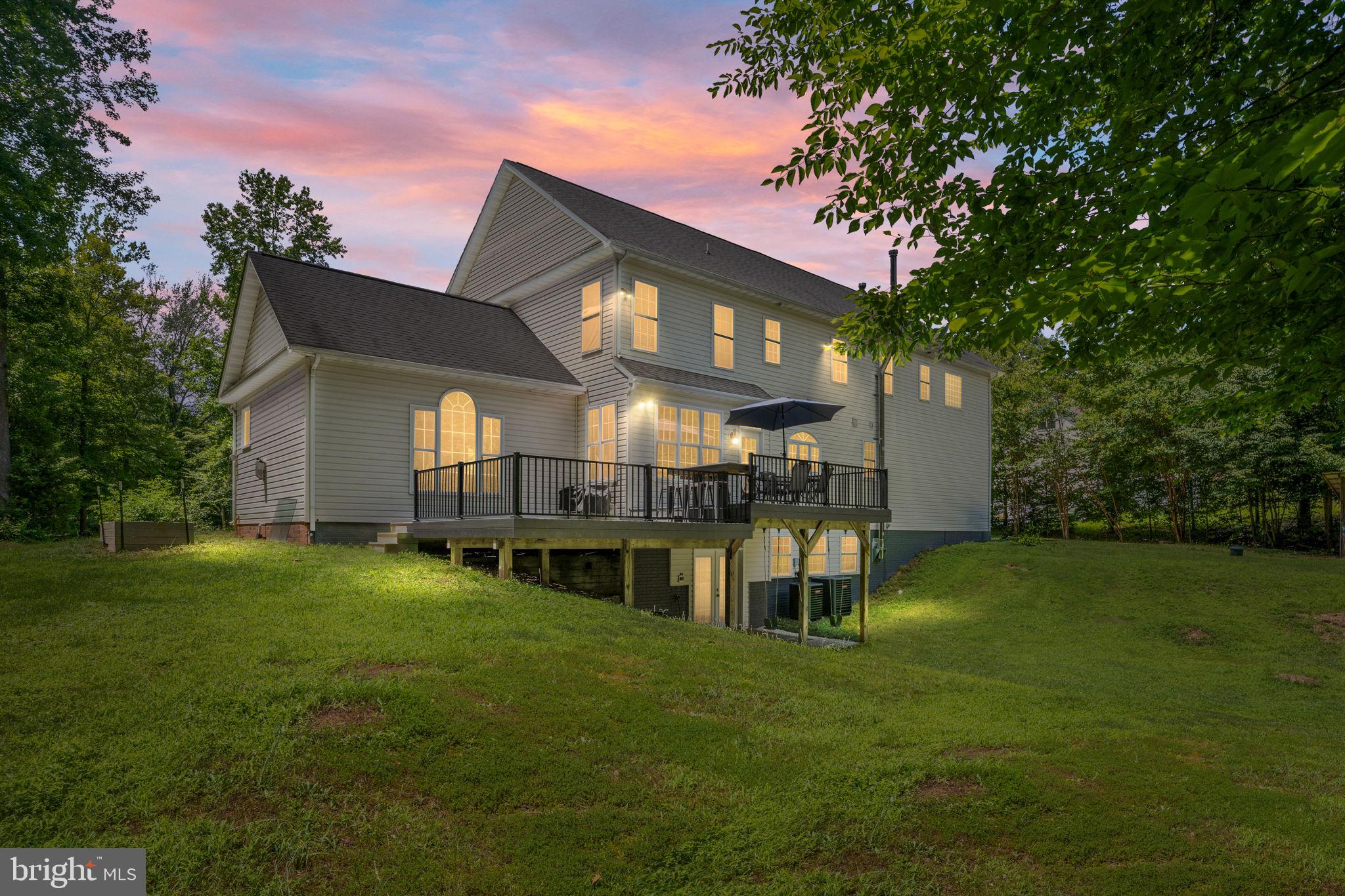182 Wood Landing Road Fredericksburg, VA 22405 - Photo 102 of 102 a view of a house with a big yard plants and large trees