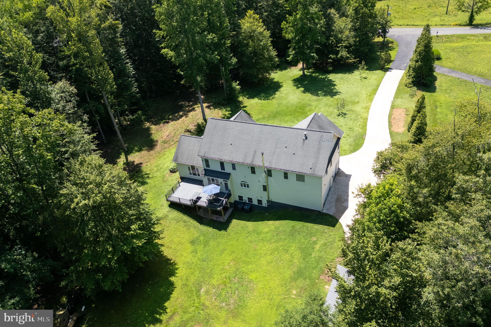 182 Wood Landing Road Fredericksburg, VA 22405 - Photo 12 of 102 an aerial view of a house with swimming pool and garden