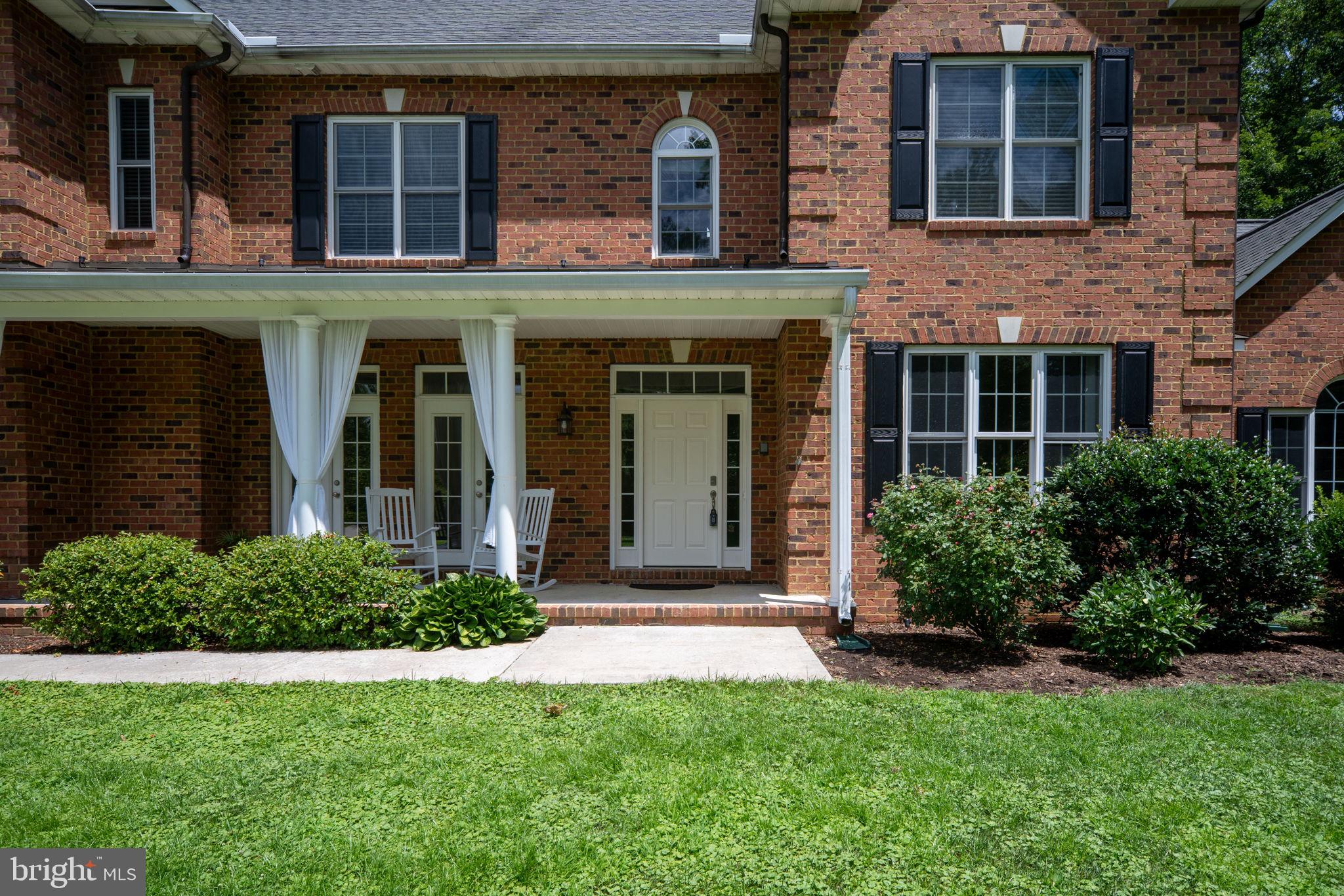 182 Wood Landing Road Fredericksburg, VA 22405 - Photo 13 of 102 a front view of a house with a yard