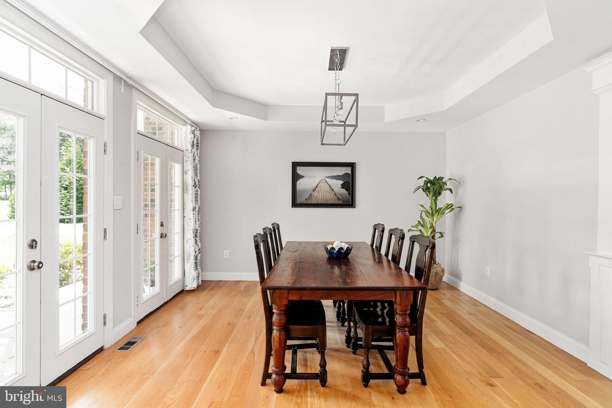182 Wood Landing Road Fredericksburg, VA 22405 - Photo 19 of 102 a view of a dining room with furniture window and wooden floor