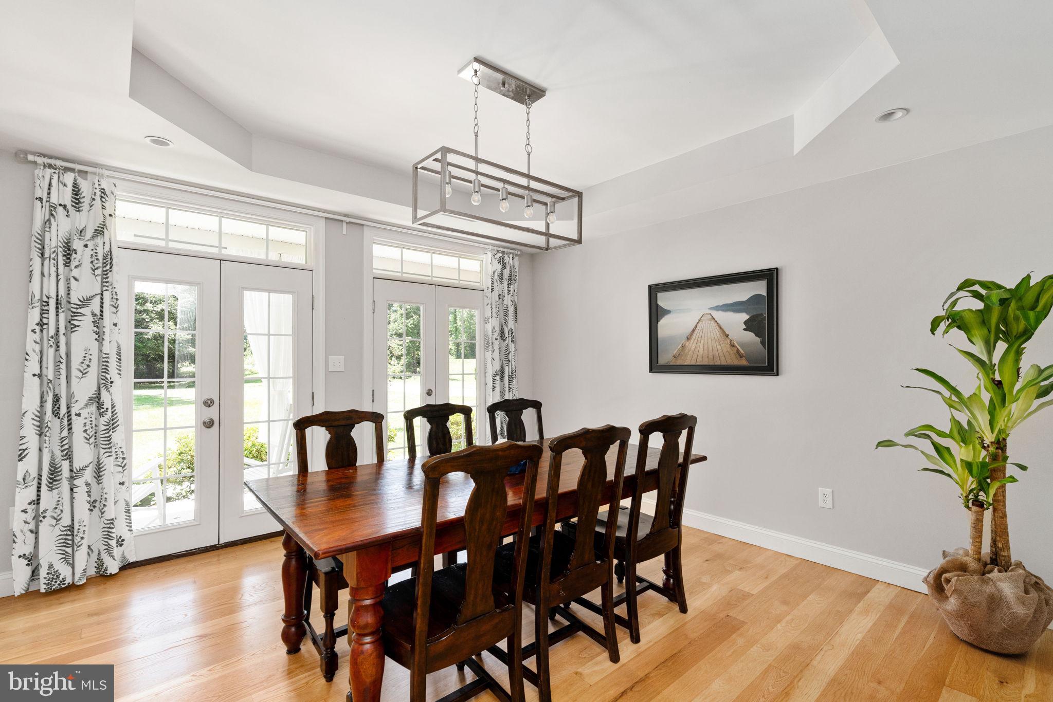 182 Wood Landing Road Fredericksburg, VA 22405 - Photo 20 of 102 a view of a dining room with furniture window and wooden floor