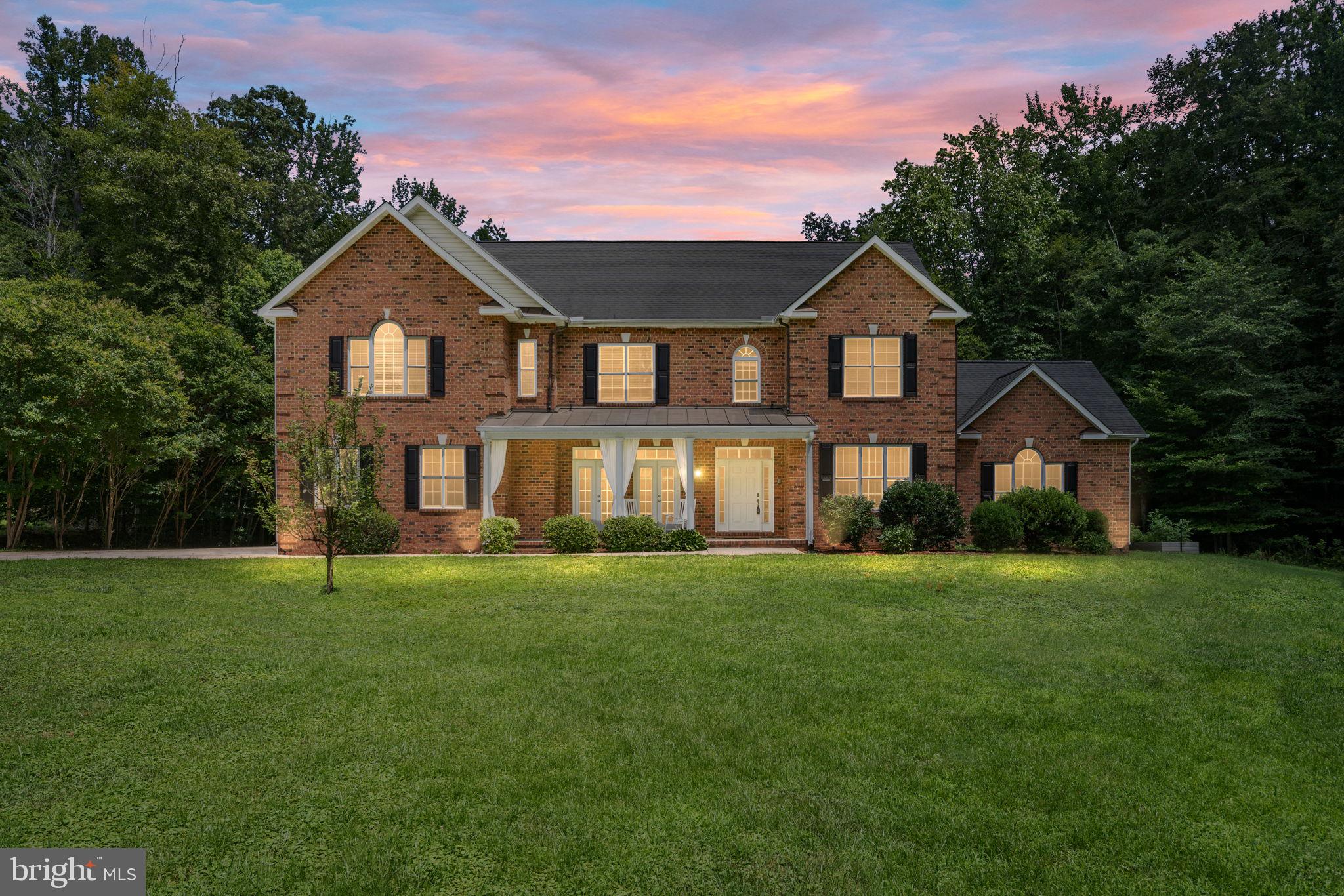 182 Wood Landing Road Fredericksburg, VA 22405 - Photo 2 of 102 a front view of a house with a yard