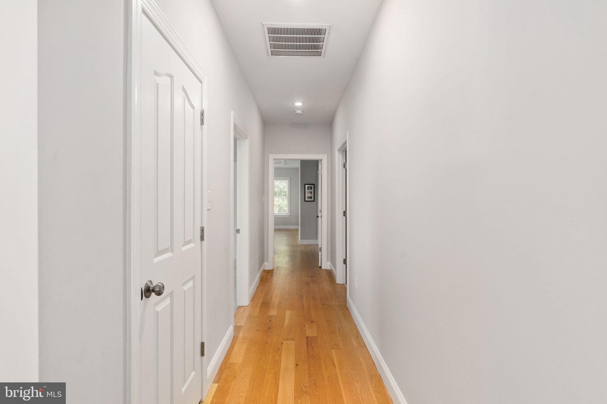 182 Wood Landing Road Fredericksburg, VA 22405 - Photo 45 of 102 a view of a hallway with wooden floor and staircase