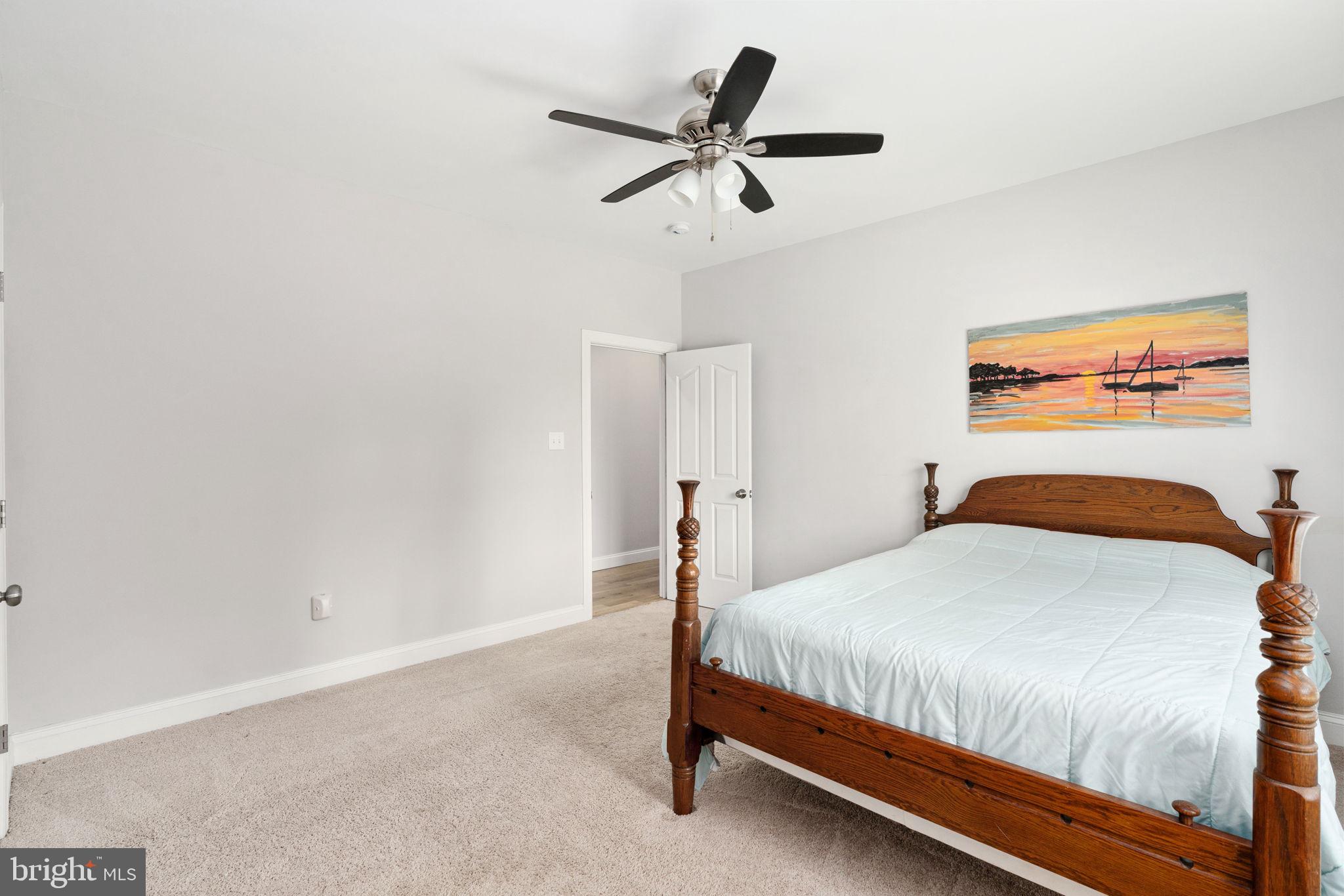 182 Wood Landing Road Fredericksburg, VA 22405 - Photo 55 of 102 a bedroom with a bed and a ceiling fan