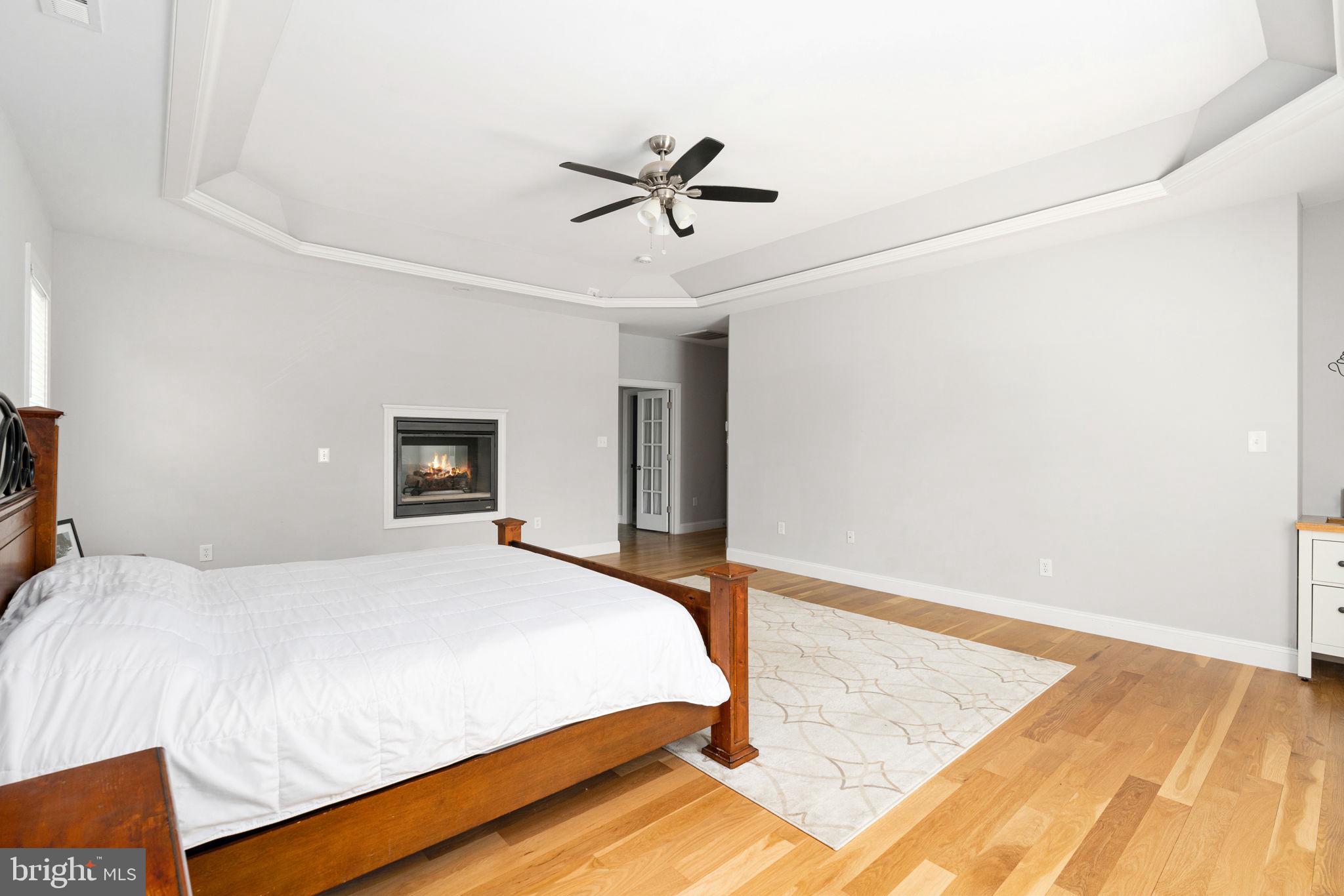 182 Wood Landing Road Fredericksburg, VA 22405 - Photo 61 of 102 a bedroom with a bed and a night stand