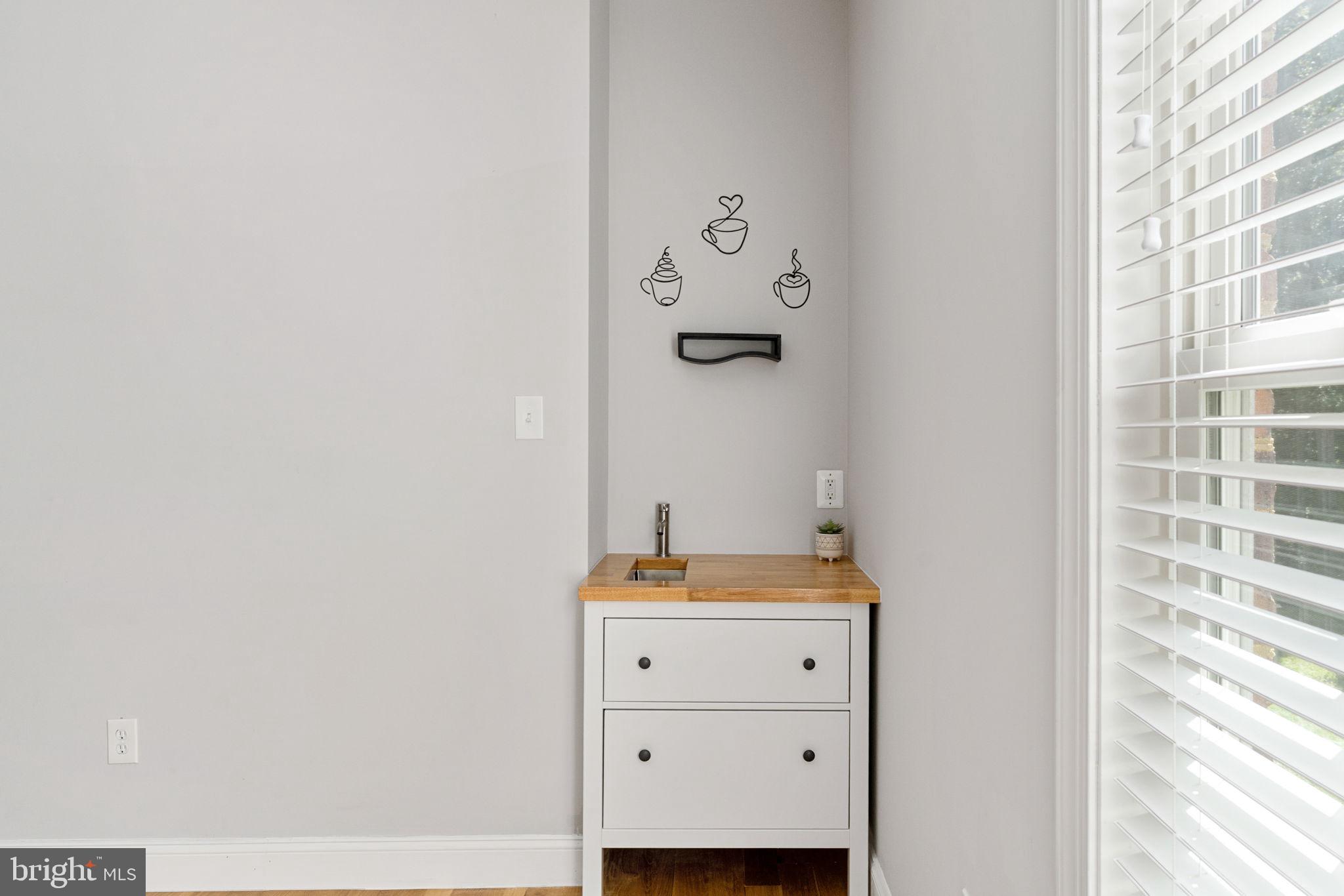 182 Wood Landing Road Fredericksburg, VA 22405 - Photo 63 of 102 a bathroom with a granite countertop sink and a mirror