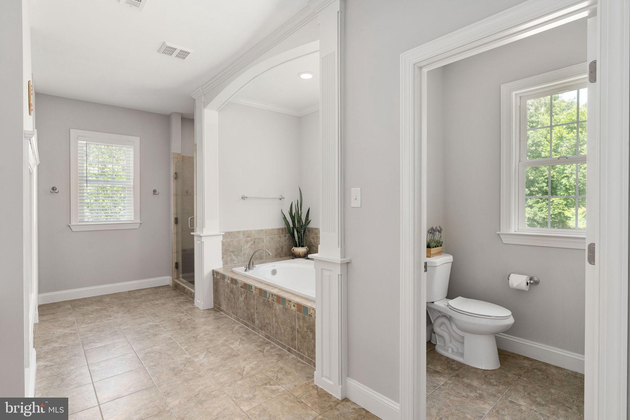 182 Wood Landing Road Fredericksburg, VA 22405 - Photo 65 of 102 a bathroom with a sink a toilet and a window
