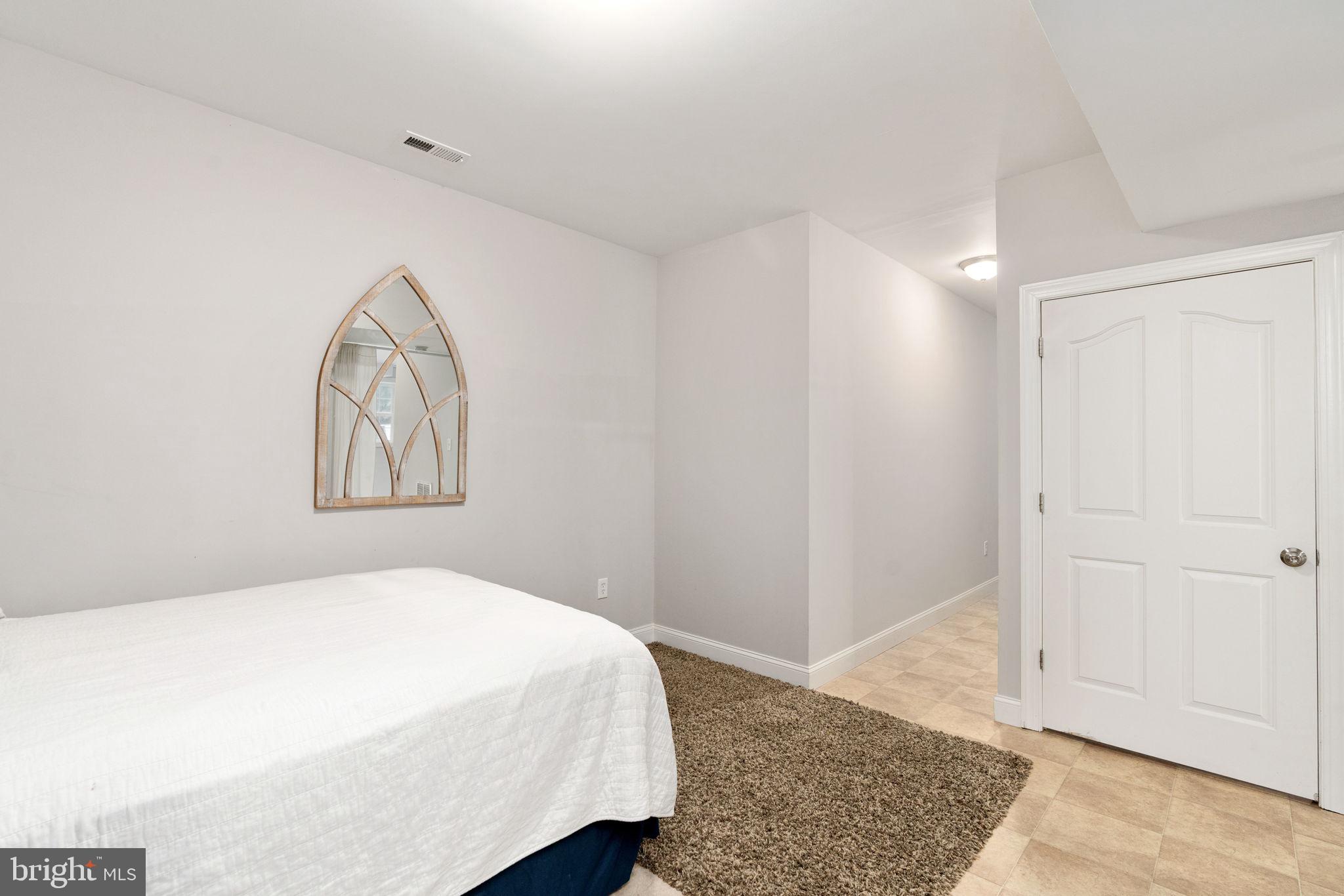 182 Wood Landing Road Fredericksburg, VA 22405 - Photo 78 of 102 a bedroom with a bed and a window