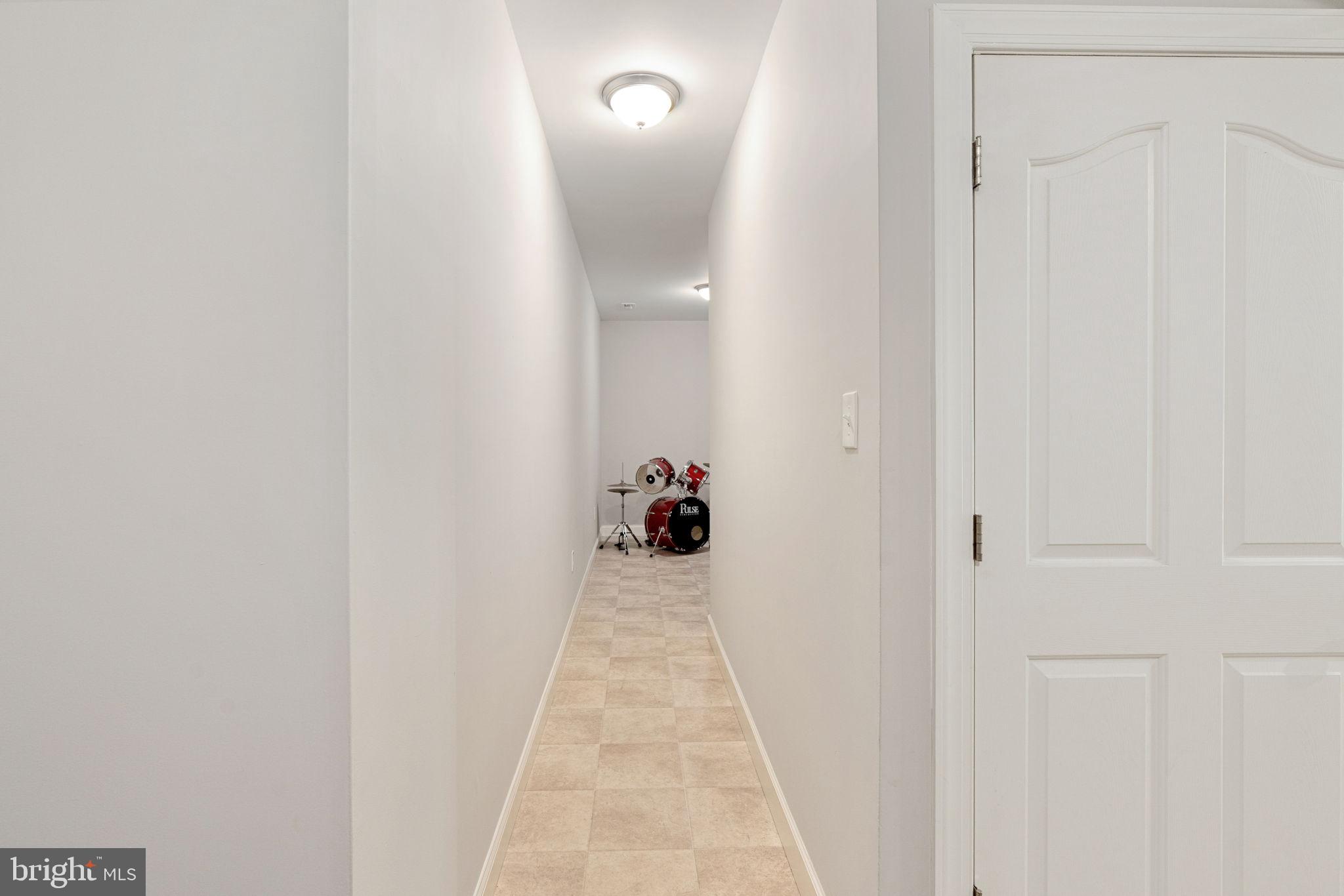 182 Wood Landing Road Fredericksburg, VA 22405 - Photo 79 of 102 a view of a hallway with wooden floor and a bathroom