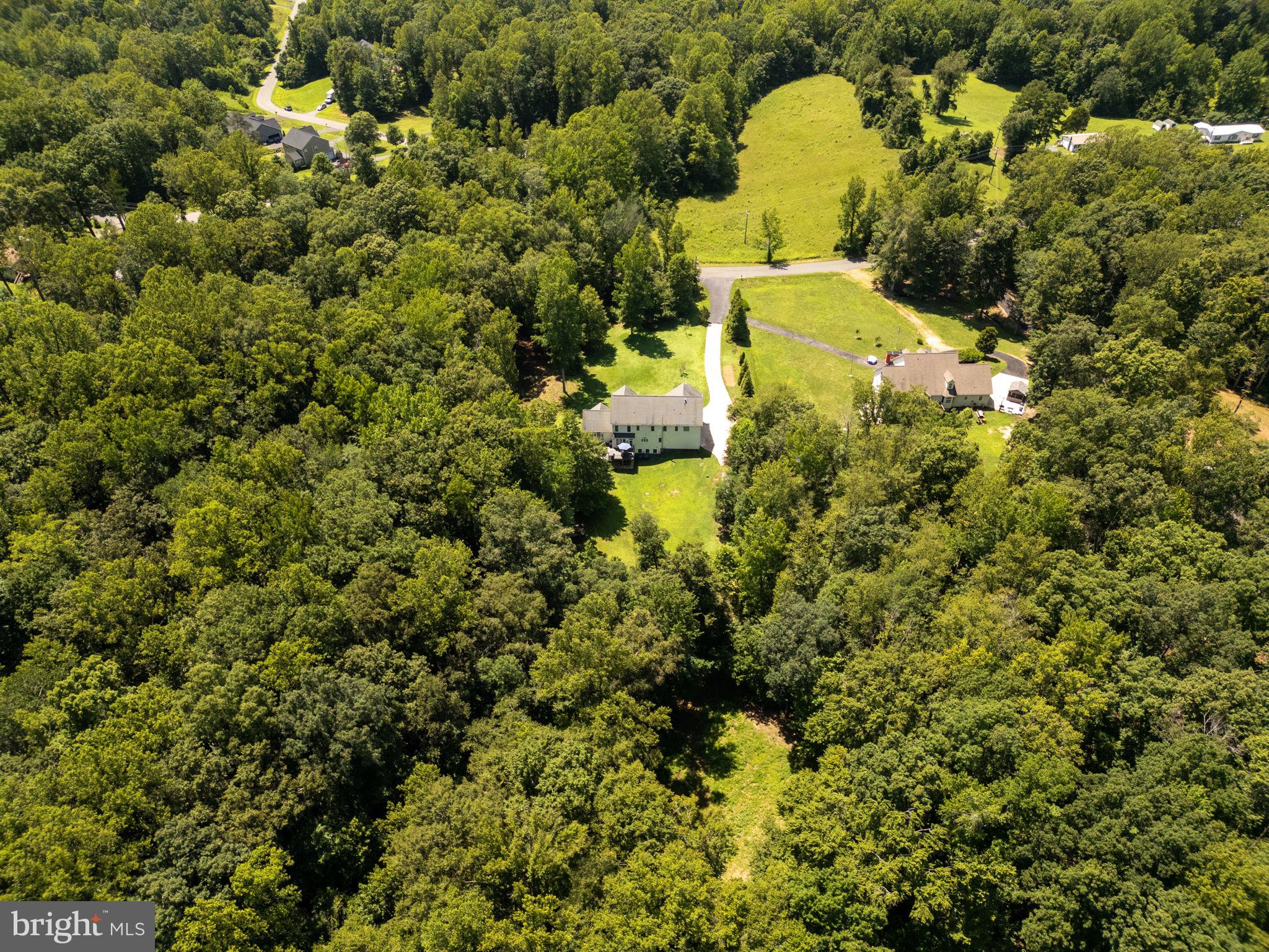 182 Wood Landing Road Fredericksburg, VA 22405 - Photo 94 of 102 a aerial view of a house with a yard and swimming pool