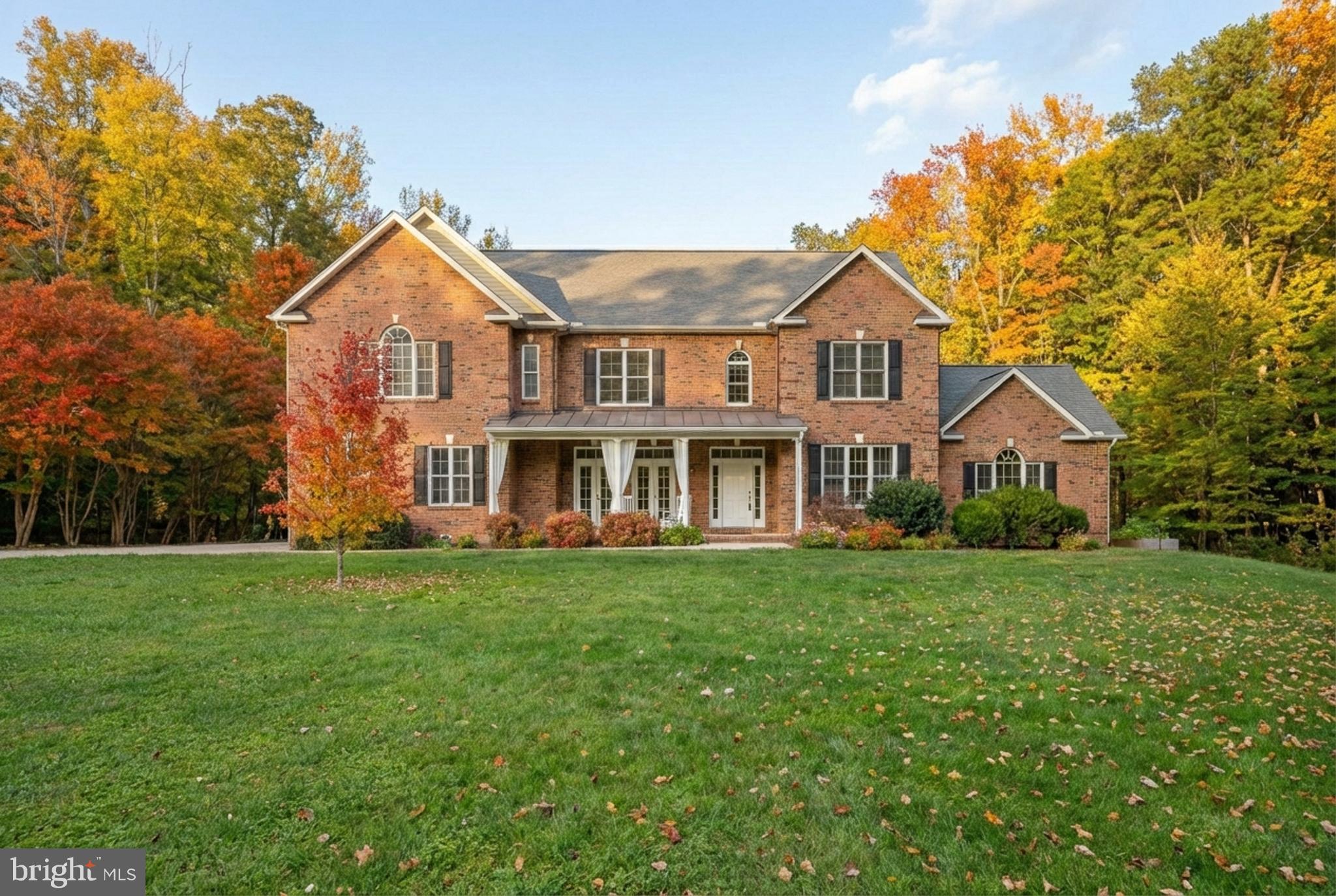 182 Wood Landing Road Fredericksburg, VA 22405 - Photo 100 of 102 a front view of a house with a garden
