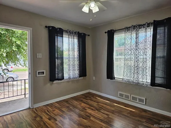 a kitchen with a white stove top oven and cabinets