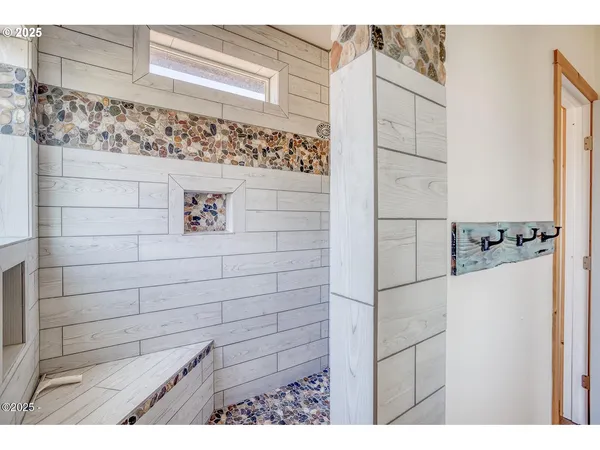 a bathroom with a shower and a sink