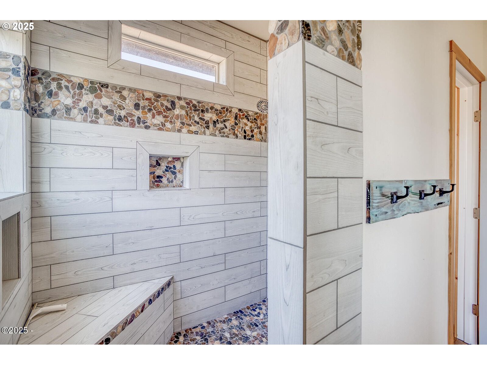 946 North Echo Mountain Road Otis, OR 97368 - Photo 23 of 48 a bathroom with a shower and a sink