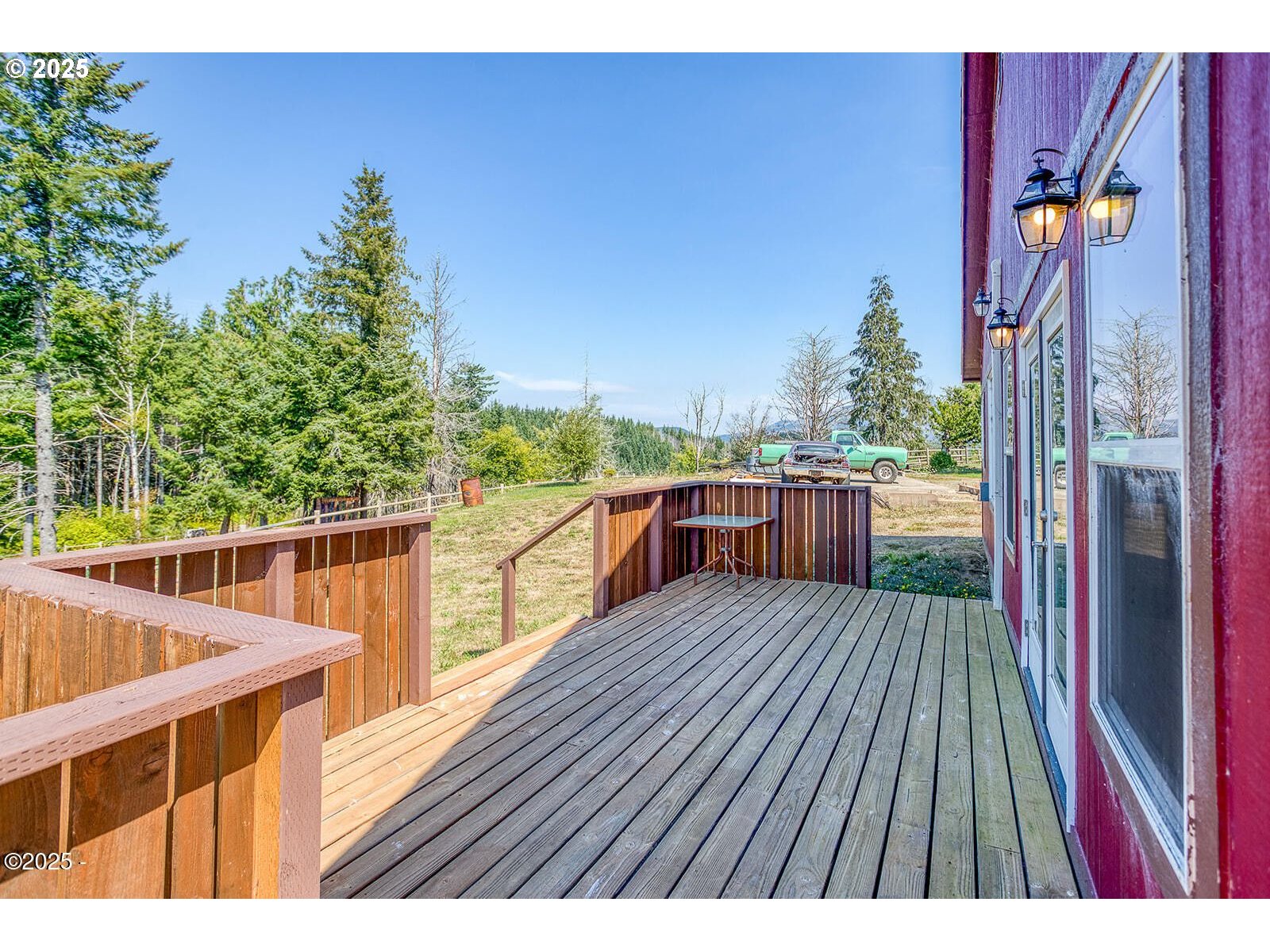 946 North Echo Mountain Road Otis, OR 97368 - Photo 28 of 48 a balcony with wooden floor and outdoor space