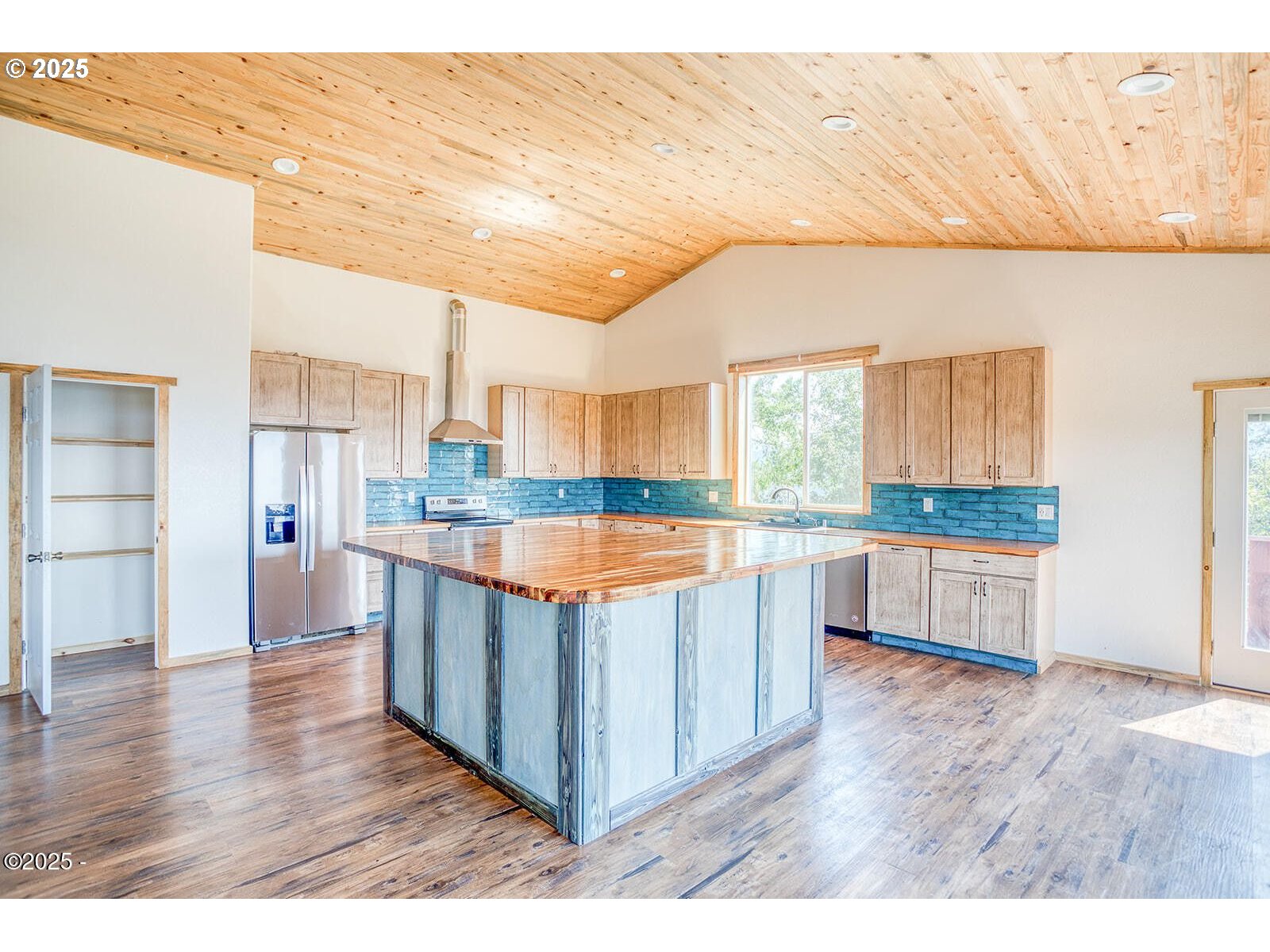 946 North Echo Mountain Road Otis, OR 97368 - Photo 9 of 48 a large kitchen with stainless steel appliances granite countertop a large counter top and a stove
