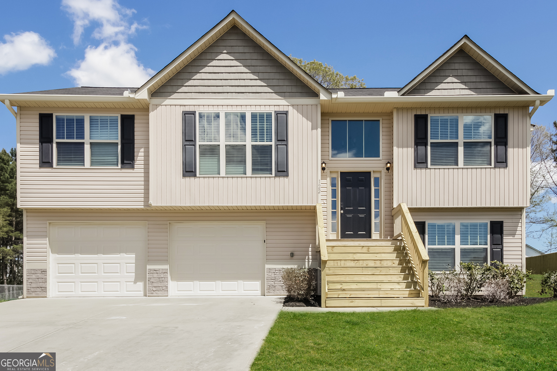 a front view of a house with garden