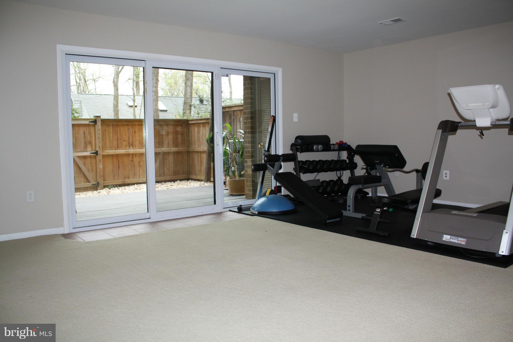 2046 Headlands Circle Reston, VA 20191 - Photo 16 of 18 basement rec room with new sliding glass doors