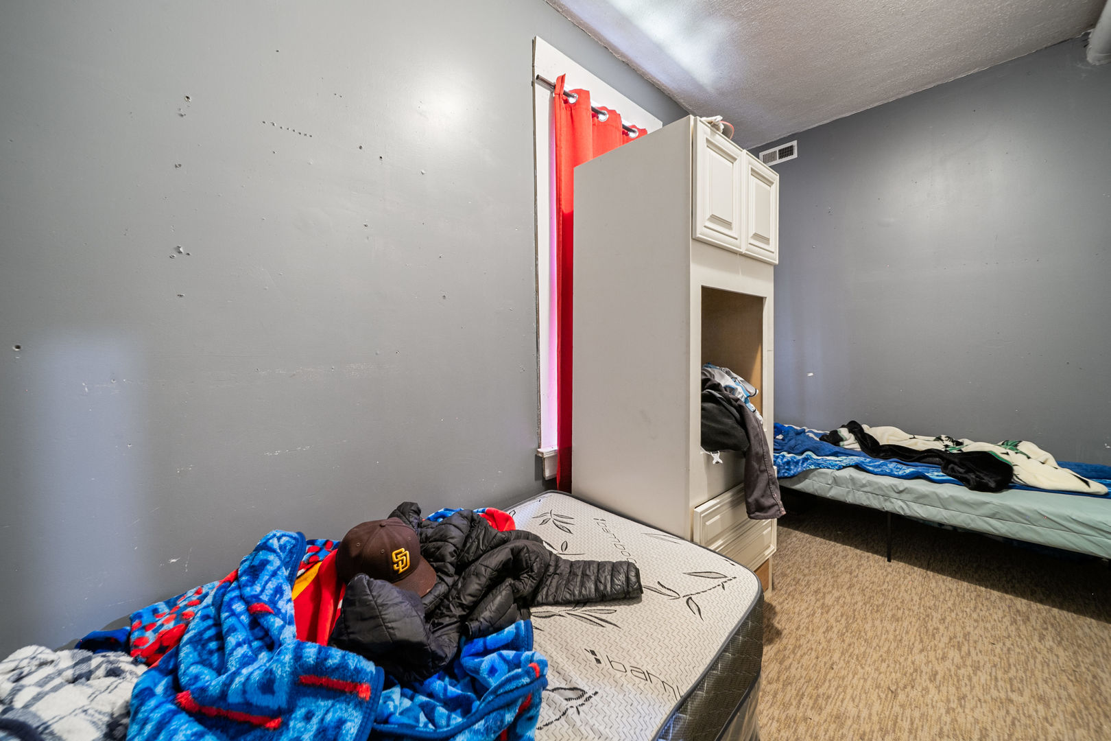 2522 South Christiana Avenue Chicago, IL 60623 - Photo 7 of 8 a bedroom with a bed and a dresser in it