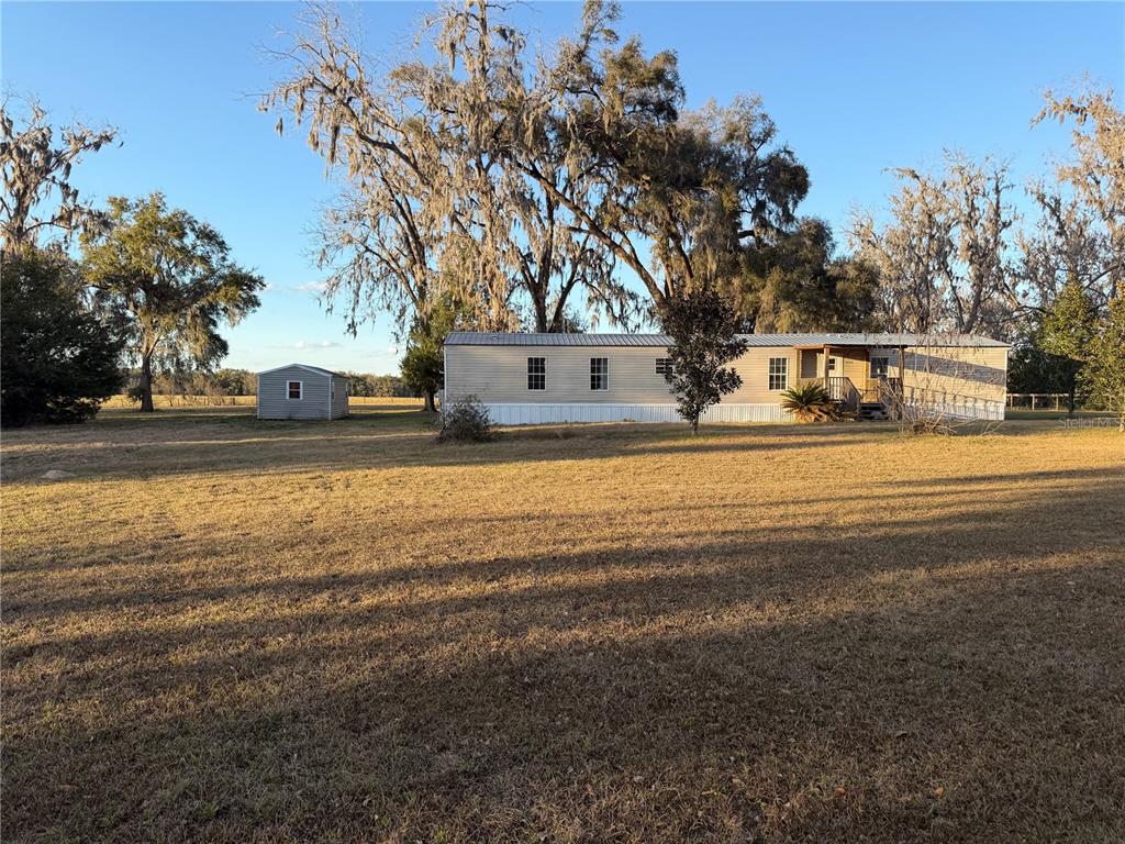 20638 Southwest 38th Avenue Newberry, FL 32669 - Photo 6 of 8 a view of a house with a yard