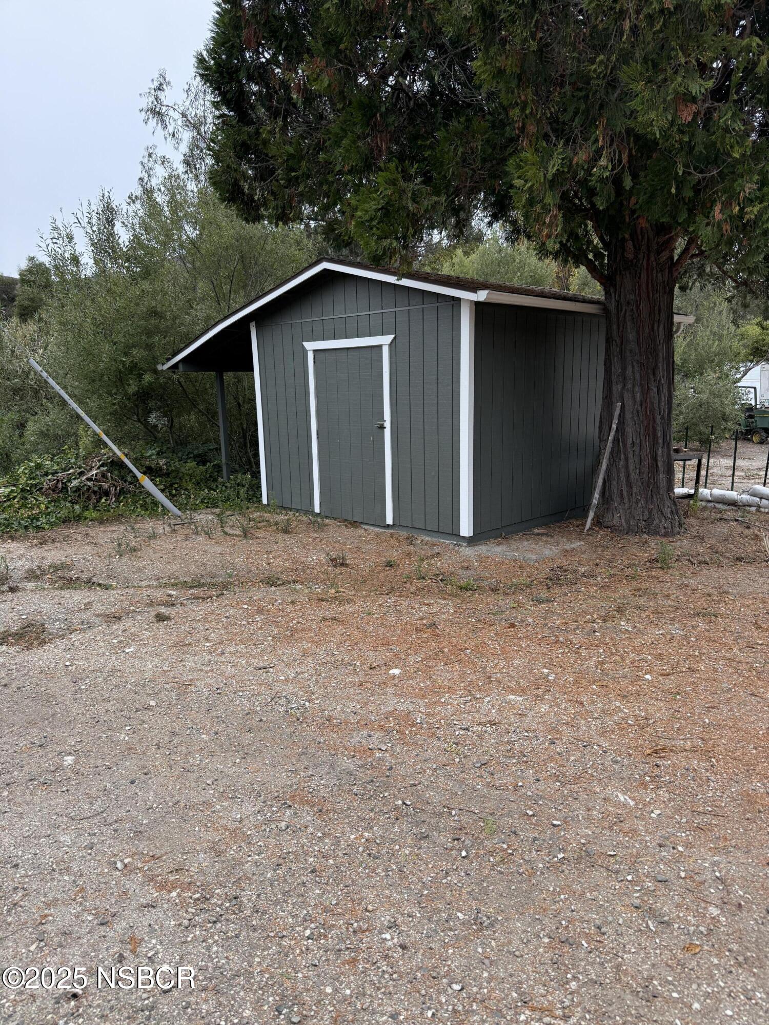 1485 San Miguelito Road Lompoc, CA 93436 - Photo 10 of 10 a house with trees in the background